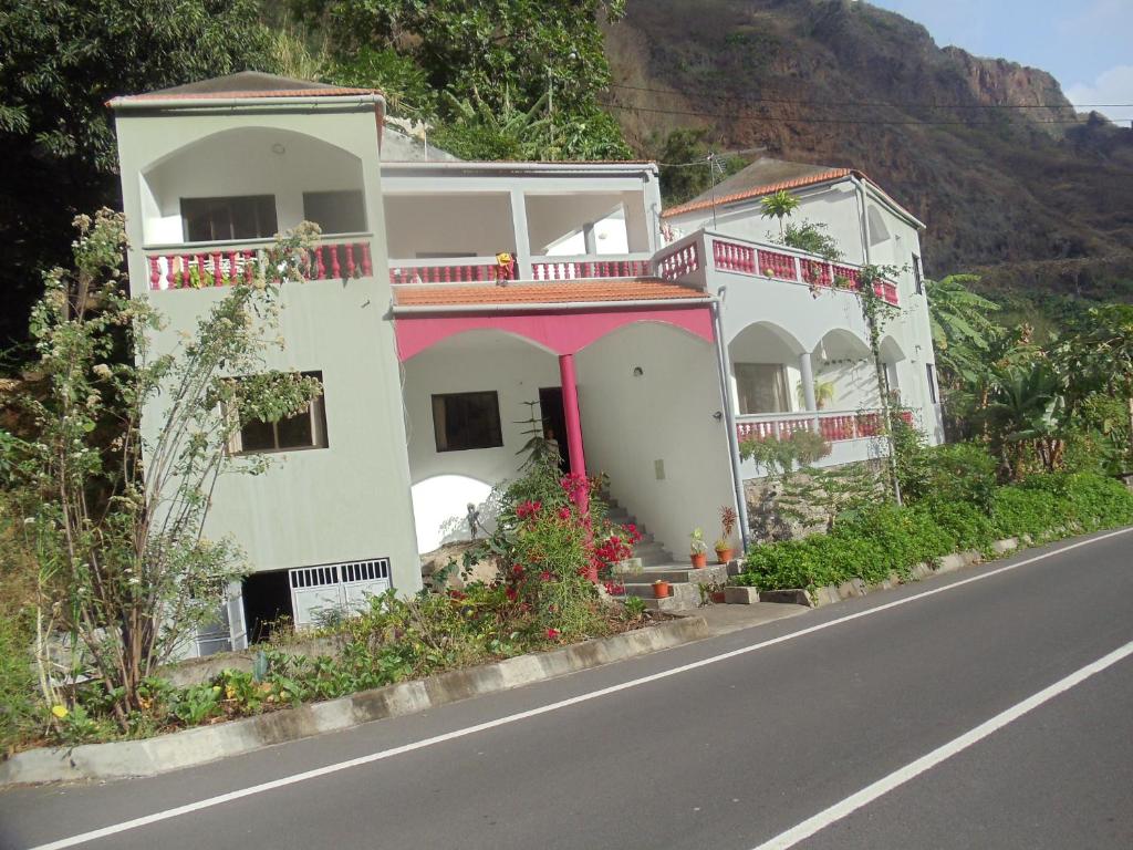 a row of houses on the side of a road at Damontanha in Ribeira Grande