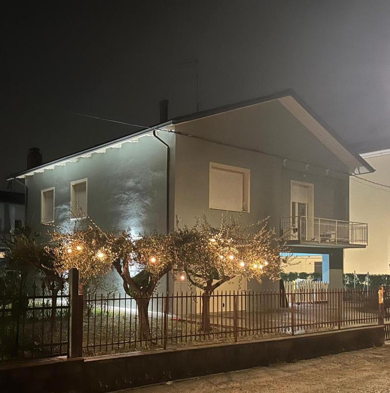 a house with christmas lights in front of it at Parrot House in Bertinoro