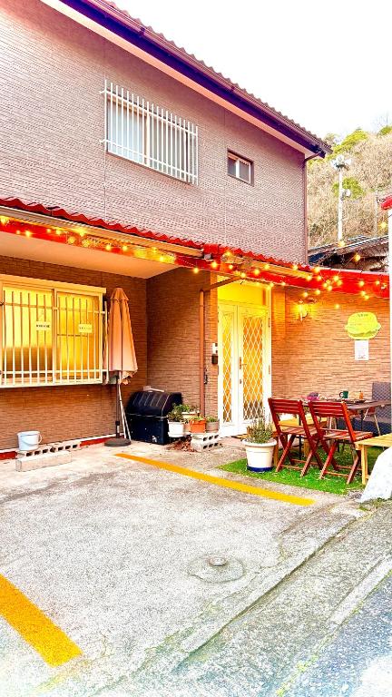 a house with a patio with a table and chairs at Grace House Hill Paradise Atami in Atami