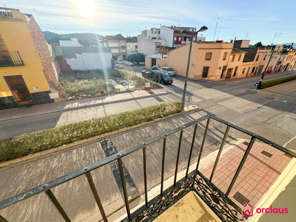 a view of a city street from a balcony at El Mini Piso in San Juan de Moró