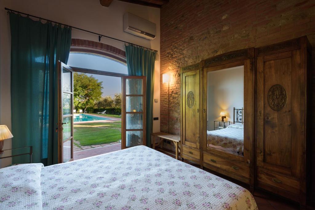 Postel nebo postele na pokoji v ubytování La Casa Delle Querce