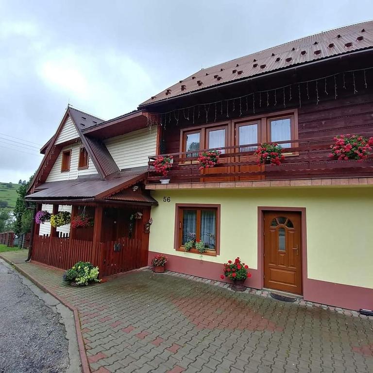 a house with a brick driveway in front of it at Agroturystyka Ela in Rzepiska