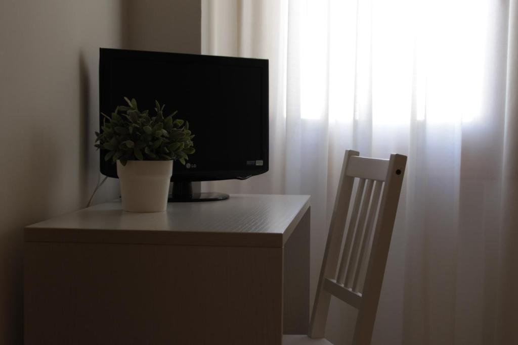 TV a/nebo společenská místnost v ubytování Hotel da Romagnolo