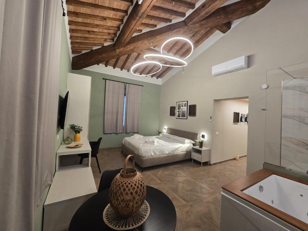 a bedroom with a bed and a table in a room at Il Podere Orto in San Gimignano