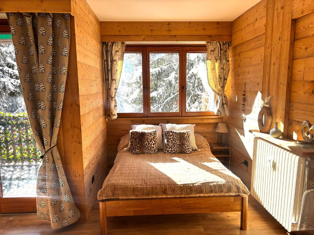 a bedroom with a bed in a room with a window at Studio Piccola Renna in Limone Piemonte
