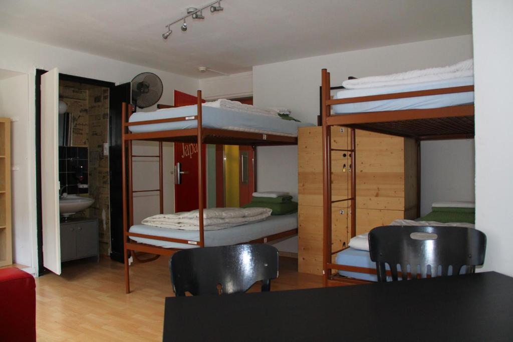 Postel nebo postele na pokoji v ubytování Oldtown Hostel Otter