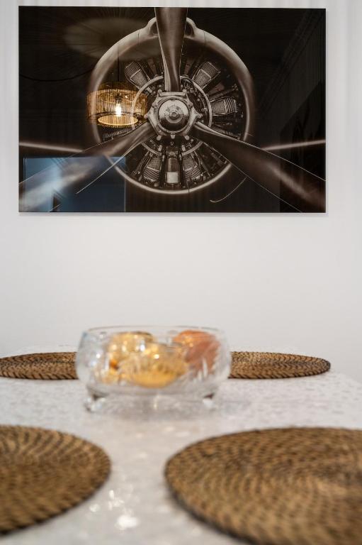 a table with a plate of donuts in a glass bowl at El Hierro Bed in Valverde