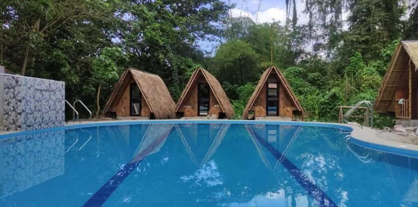 a rendering of a house with a pool at Serenity Cove Resort in San Pablo