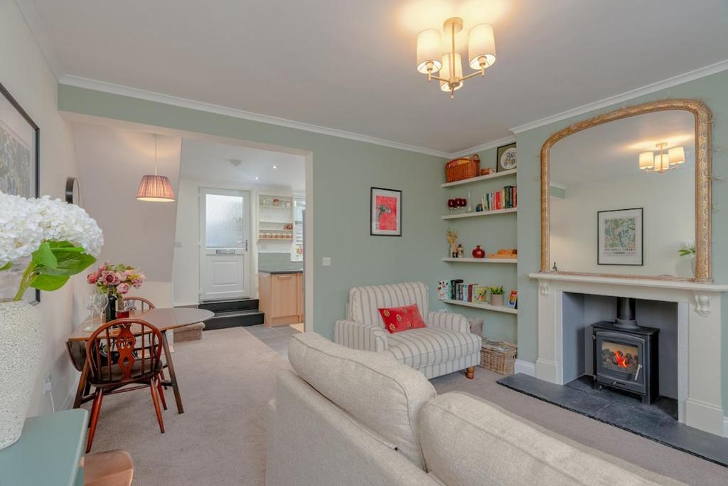 a living room with a couch and a fireplace at Three Peaks Central Cottage, Settle, 3Bed 2Bath in Settle
