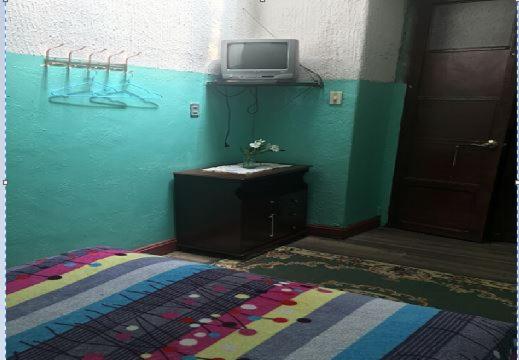 TV a/nebo společenská místnost v ubytování Hostal La Chorrera