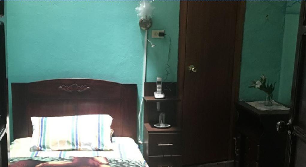 Postel nebo postele na pokoji v ubytování Hostal La Chorrera