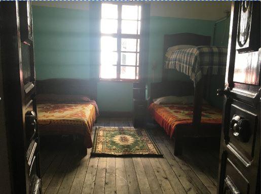 Postel nebo postele na pokoji v ubytování Hostal La Chorrera