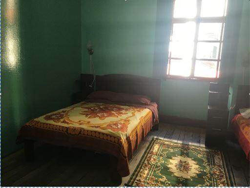 Postel nebo postele na pokoji v ubytování Hostal La Chorrera