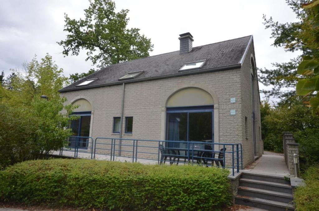 a small brick building with a table in front of it at DURBUY Residence-A202- in Durbuy