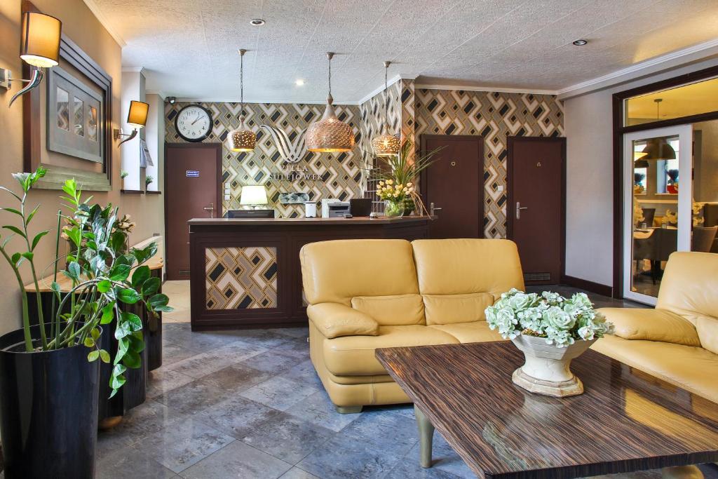 a living room with a couch and a table at Villa Sulejówek in Sulejówek