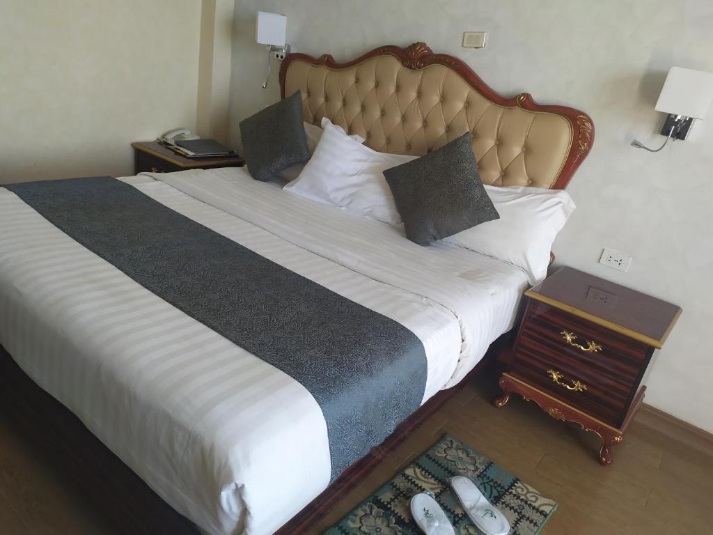 Vuode tai vuoteita majoituspaikassa Olive Hotel