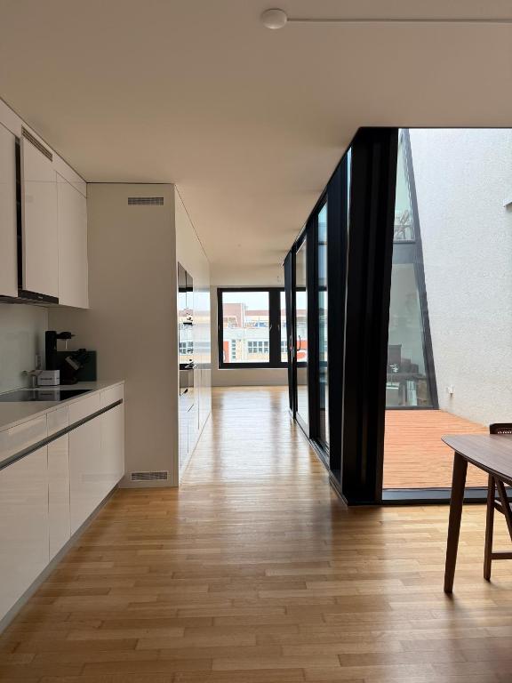 an open kitchen and dining room in a house at Zurich City Appartement in Zurich
