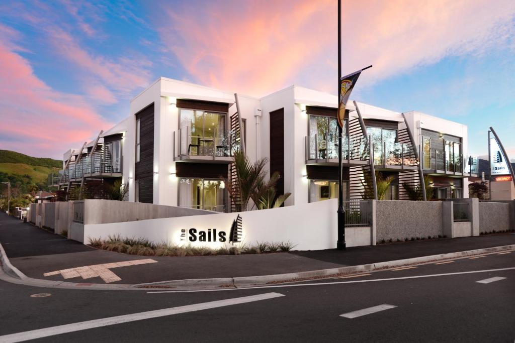 a building on the side of a street at The Sails Nelson in Nelson