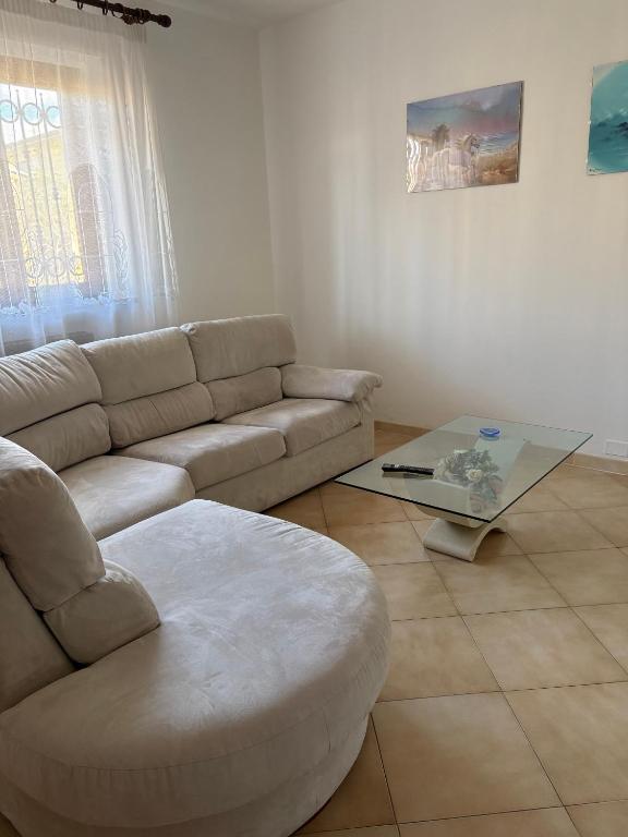 a living room with a couch and a coffee table at Casa I Limoni in Viareggio