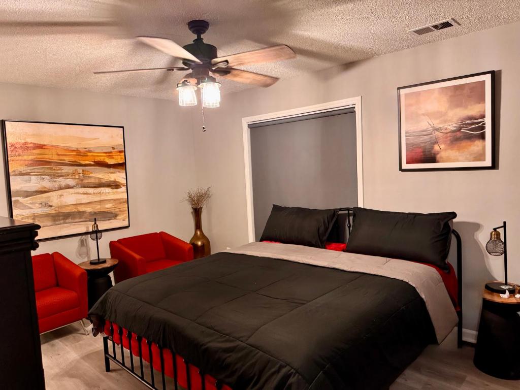 a bedroom with a bed and a ceiling fan at Convenient 3 bedroom Townhome in Raleigh
