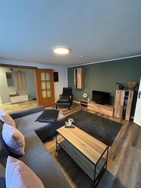 a living room with two couches and a coffee table at Ferienwohnung Clemens in Nideggen