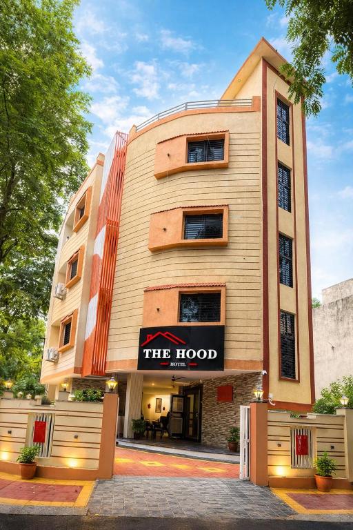 a building with a sign that reads the hotel at Hotel The Hood in Nagpur