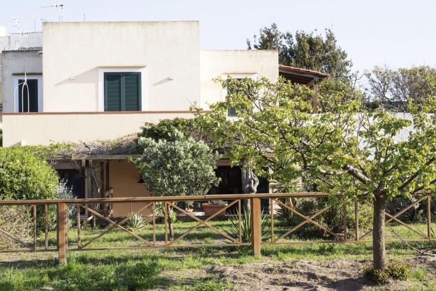 a house with a fence in front of it at La Cantina in Ventotene