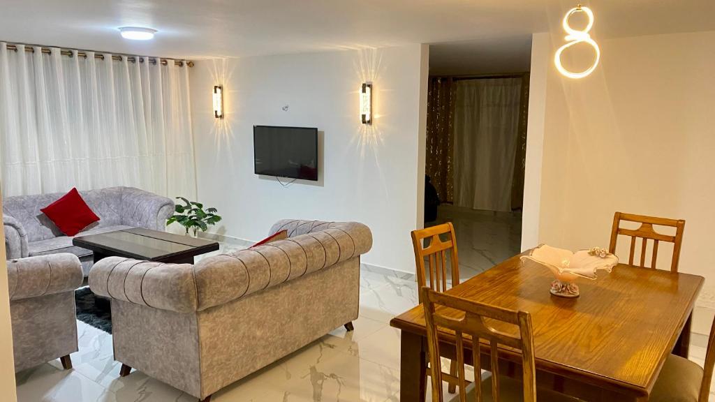 a living room with a couch and a table at W3 property in Kerak