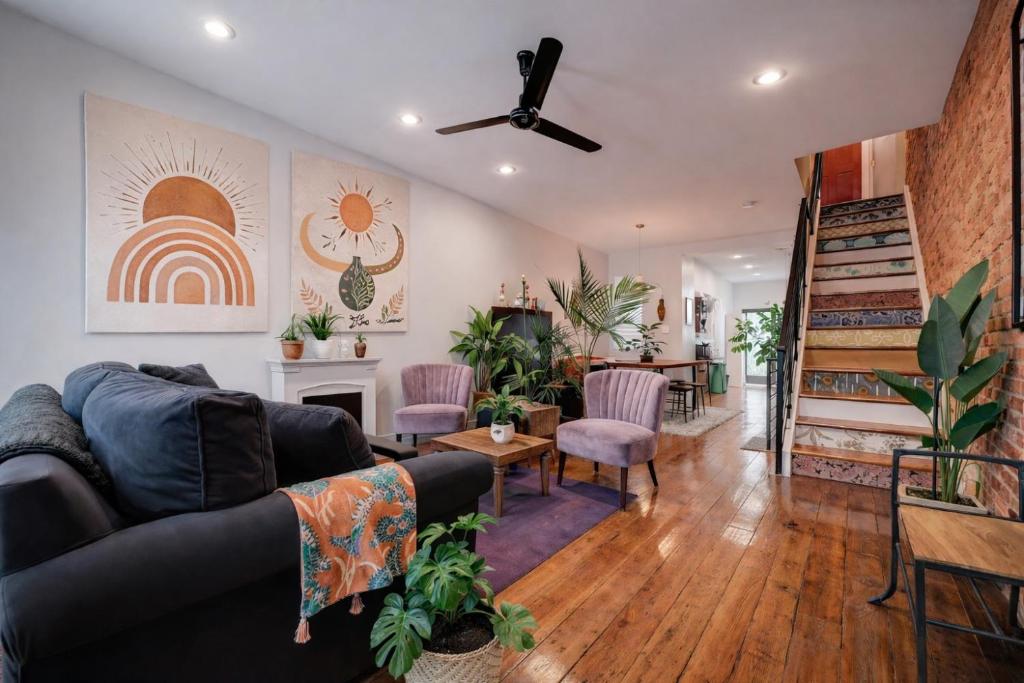a living room with a couch and a fireplace at Artsy Hidden Gem -- FREE PARKING in Philadelphia