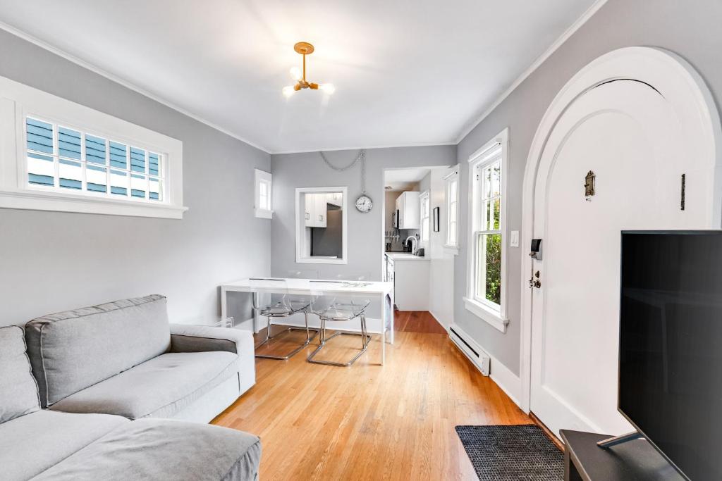 a living room with a couch and a table at Montlake Hideaway in Spite House in Seattle