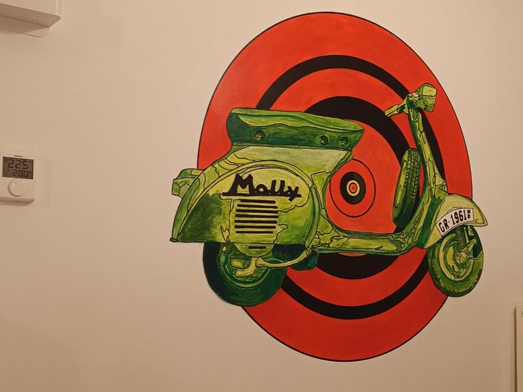 a painting of a motorcycle on a target at Molly Downtown Thessaloniki in Thessaloniki
