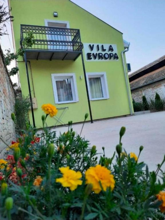 a yellow building with a sign that reads vla opera at Evropa Sombor in Sombor