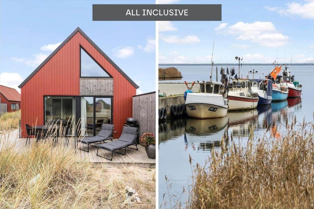 a red building with chairs and boats in the water at 940-Hvide-Sande-Langsand-169 in Hvide Sande