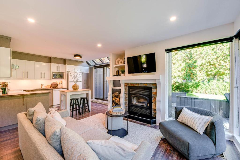 a living room with a couch and a fireplace at D-Chalet - 9 personnes - 2 chambres in Beaupré