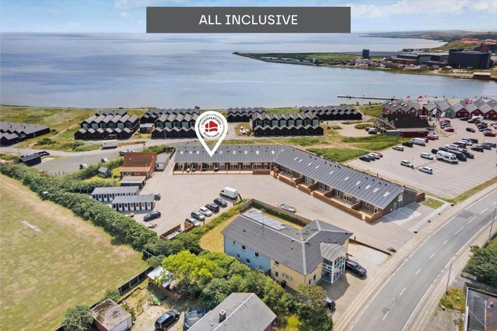 an aerial view of a building with a parking lot at 774-Hvide-Sande-Norregade-2-nr-7 in Hvide Sande