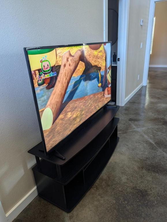 a flat screen tv sitting on top of a dresser at Special Deal on 2 Bedroom Unit 556 in Paris