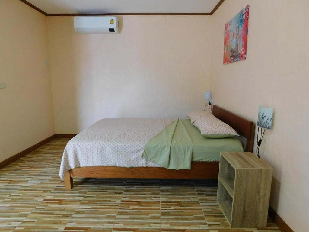 a bedroom with a bed in a room at Swiss Bonihouse Koh Yao Yai in Ban Pru Nai