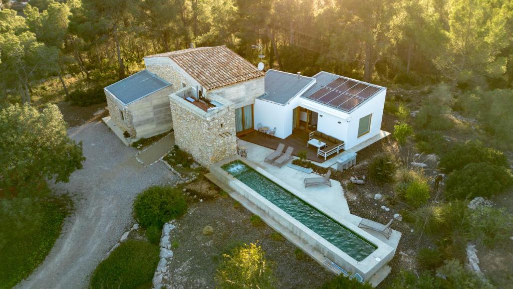 an aerial view of a house with a solar roof at Villa Can Tomeu Capdet in Sant Pere de Ribes