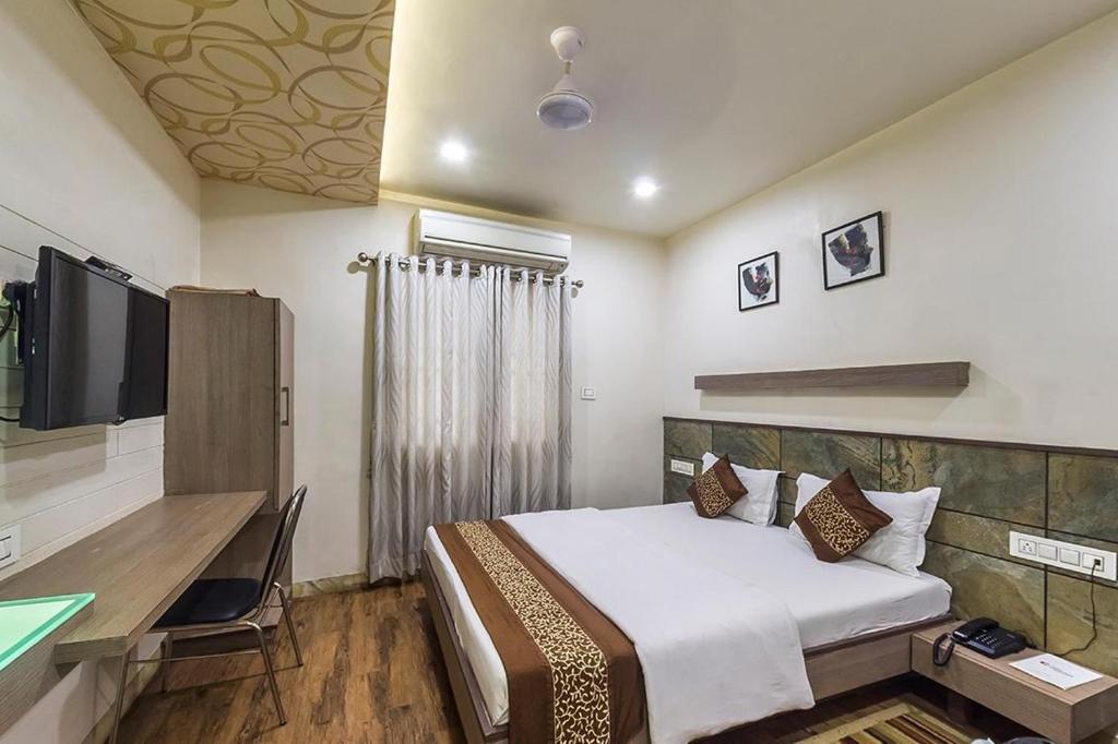 Postel nebo postele na pokoji v ubytování Hotel City Inn