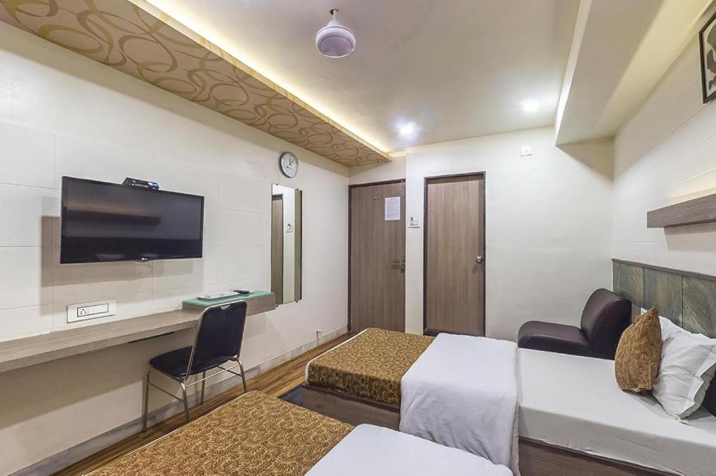 Postel nebo postele na pokoji v ubytování Hotel City Inn