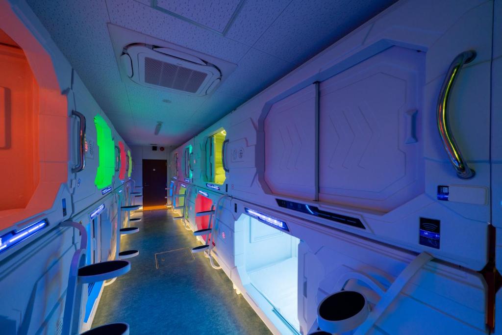 an empty train car with colorful lights on it at エイチビーイン in Hiroshima