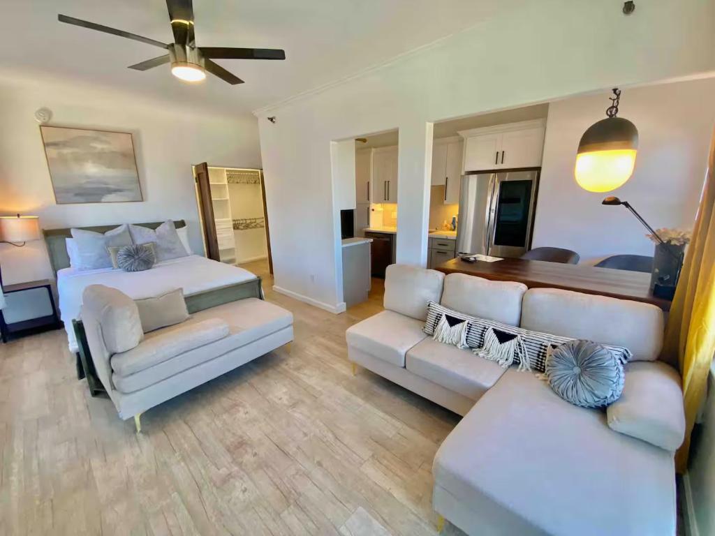 a living room with a bed and a couch at The Riviera in San Pedro