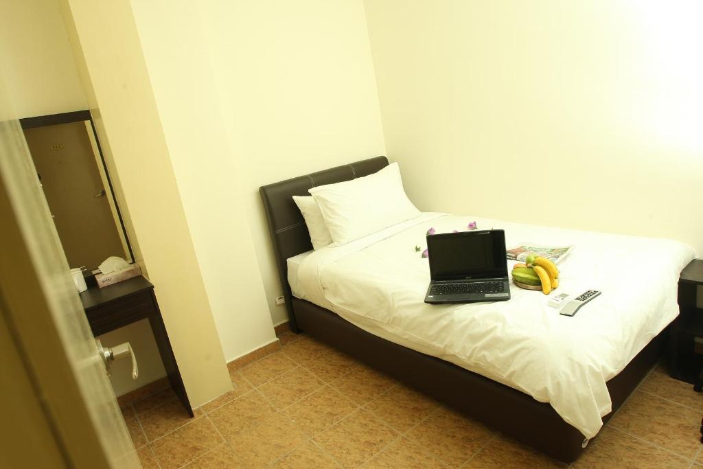 Postel nebo postele na pokoji v ubytování T-hotel JB