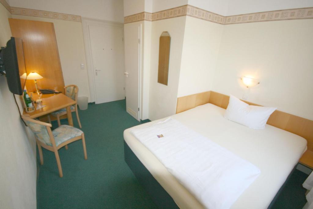 Postel nebo postele na pokoji v ubytování Classic Inn