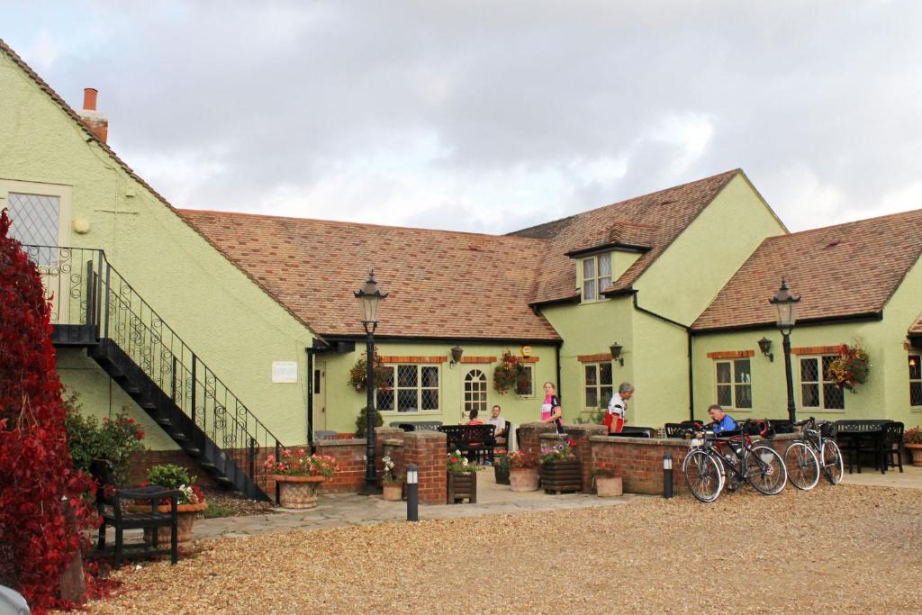 a group of buildings with bikes parked in front of them at The Green Man Stanford in Southill