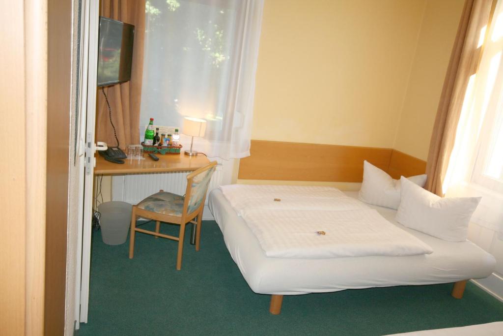 Postel nebo postele na pokoji v ubytování Classic Inn