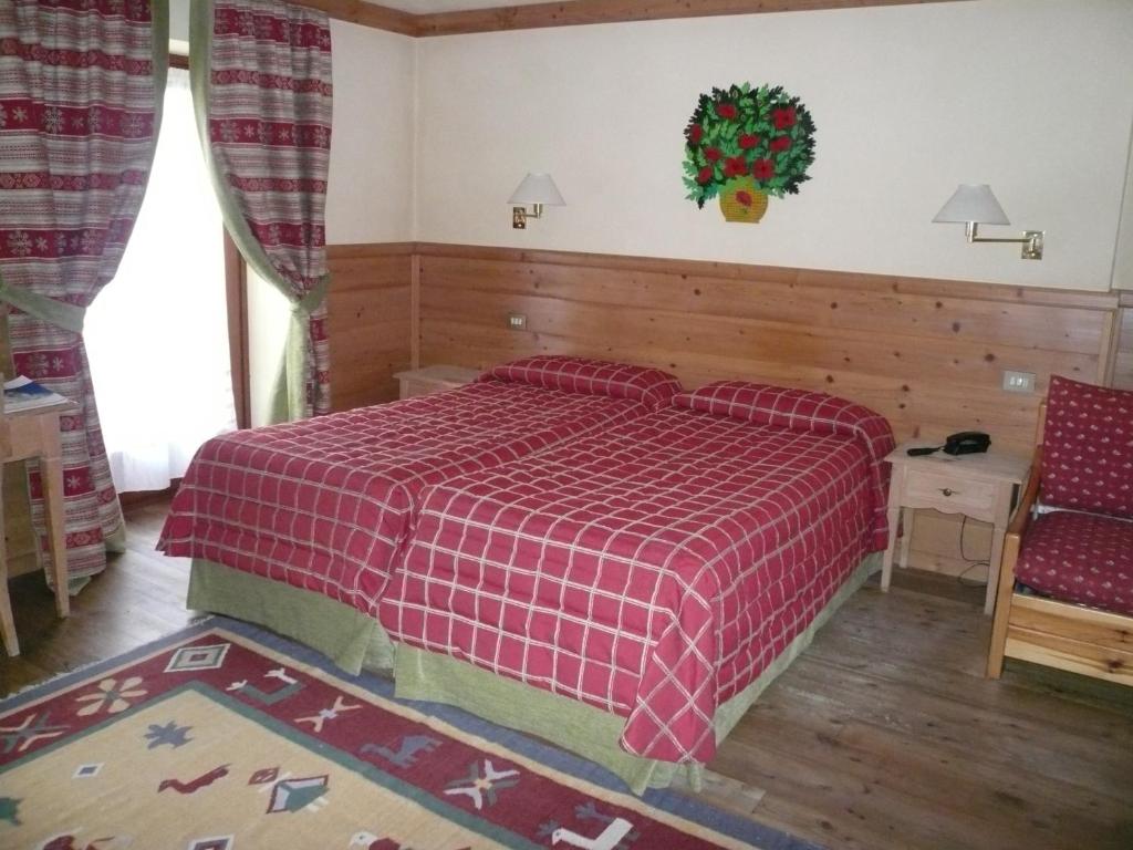 Postel nebo postele na pokoji v ubytování Hotel Mignon