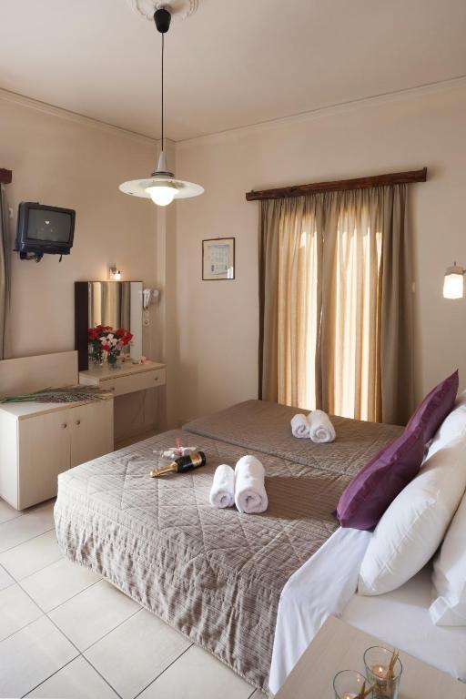 Postel nebo postele na pokoji v ubytování Francoise Hotel