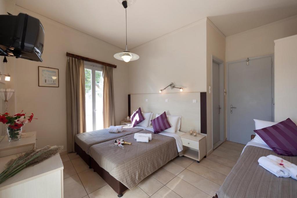 Postel nebo postele na pokoji v ubytování Francoise Hotel