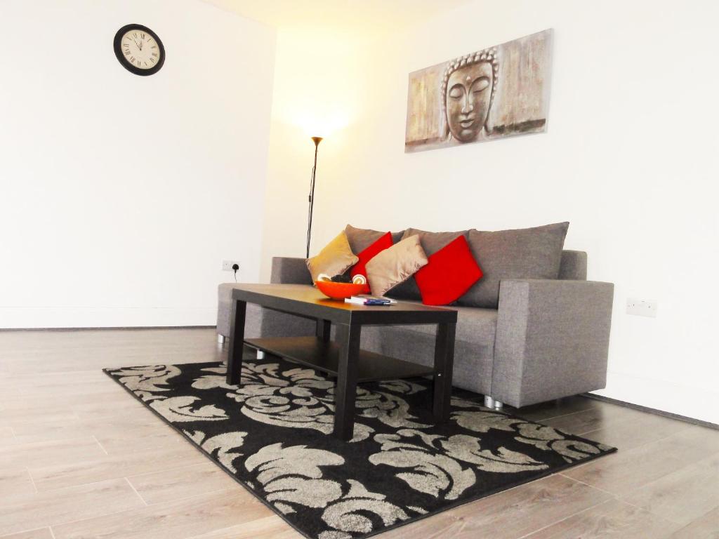 a living room with a couch and a coffee table at Camden Habitat in London